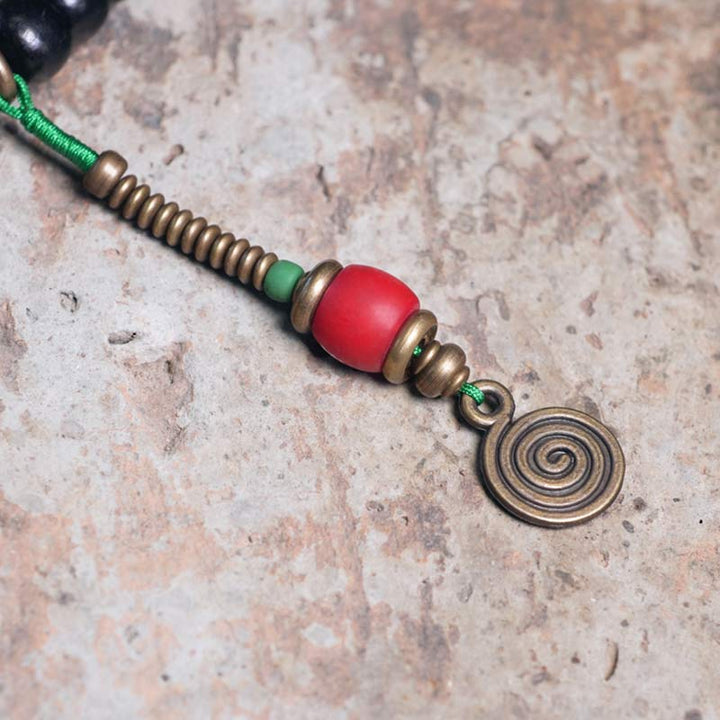 Mala Kupfer Ebenholz Balance Armband rote Perle Spirale Anhänger grün