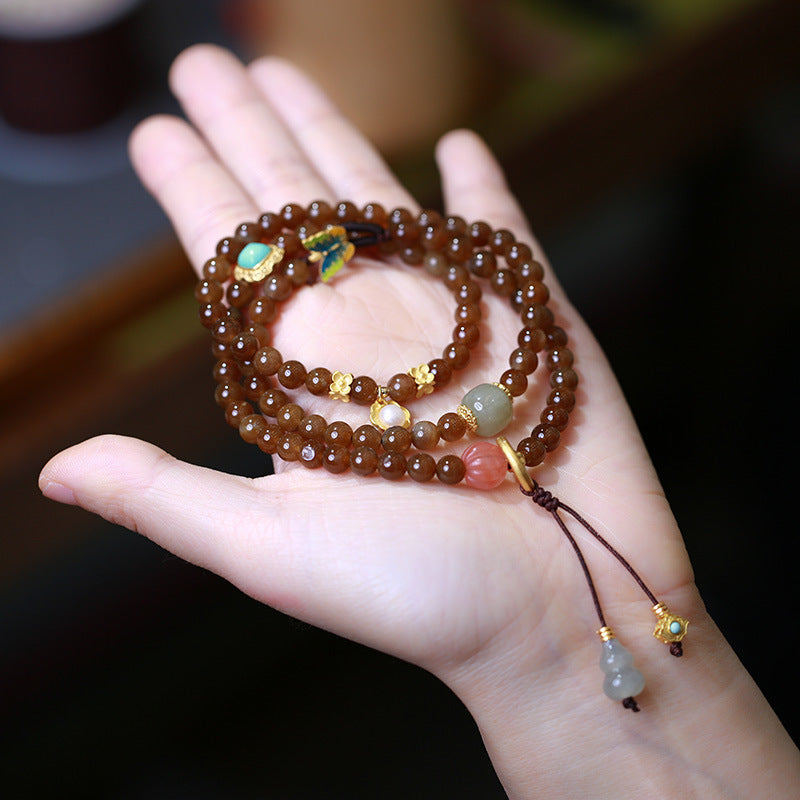 Jade Schmetterling Armband Glück Wohlstand braun Naturstein elastisch Handgelenk getragen