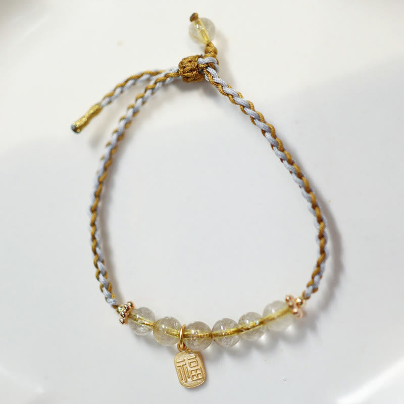 Goldenes Armband mit Jade-Perlen und Fu-Zeichen Anhänger elastisch.