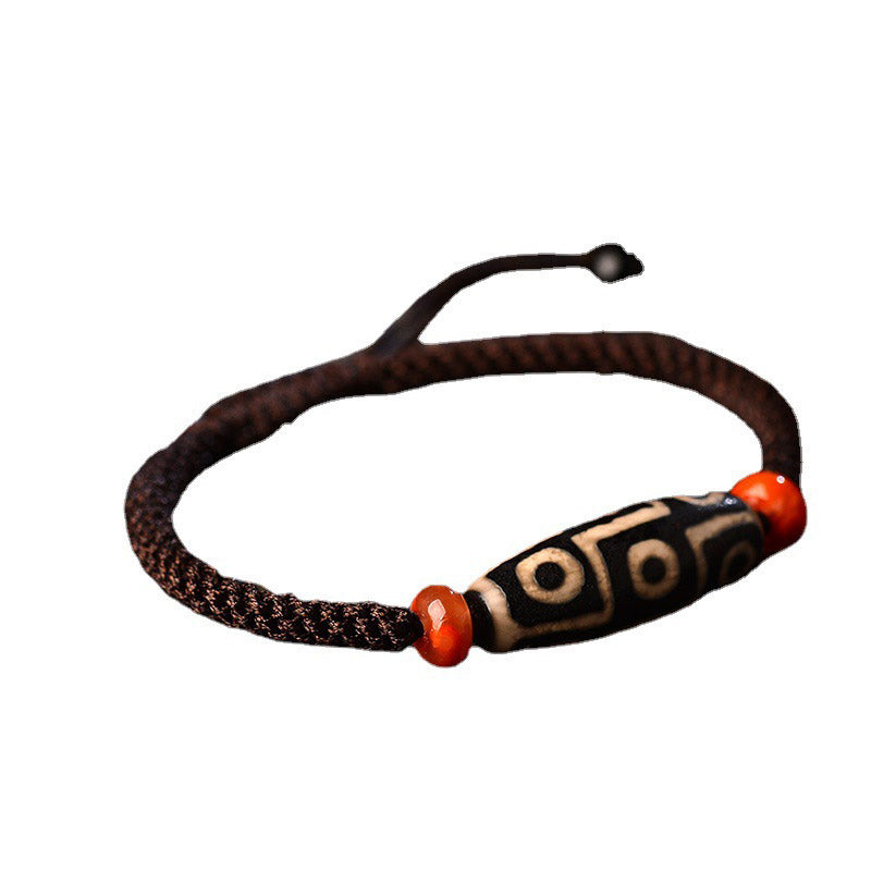 Armband Dzi-Perle Neun Augen mit roten Achatperlen, braunes Geflecht, Wohlstand Prosperität.