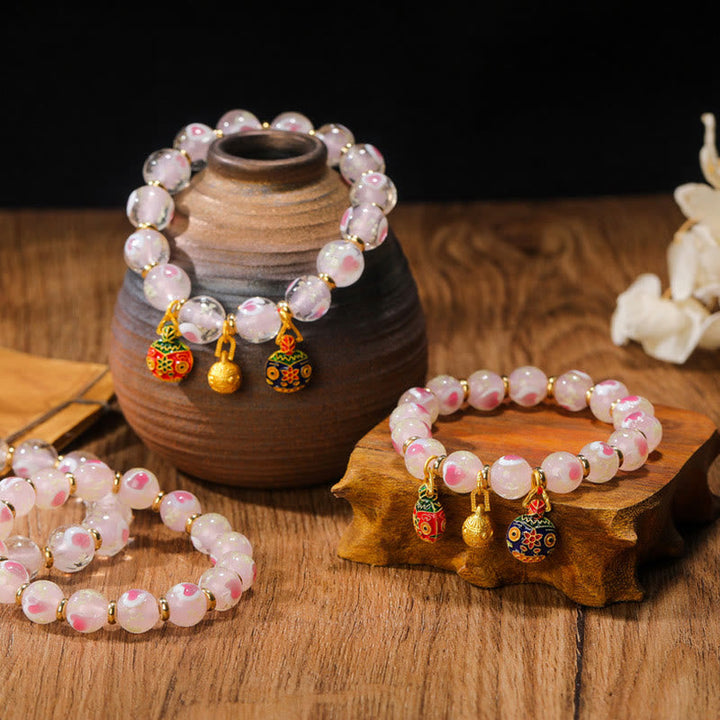 Rosenquarz Armband – Liebe & Segen mit rosa Perlen und goldfarbenen Anhängern