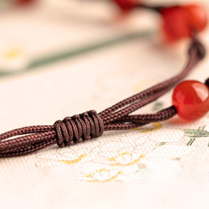 Armband Roter Achat Zinnober mit braunem Seidenband Knoten Detail