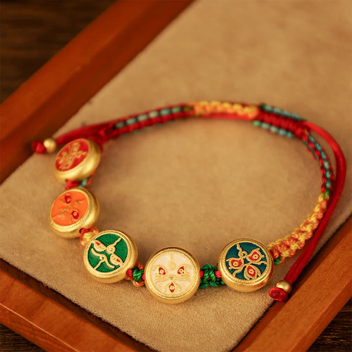 Armband Five Five – Glück & Wohlstand mit goldenen Medaillons rot geflochten.