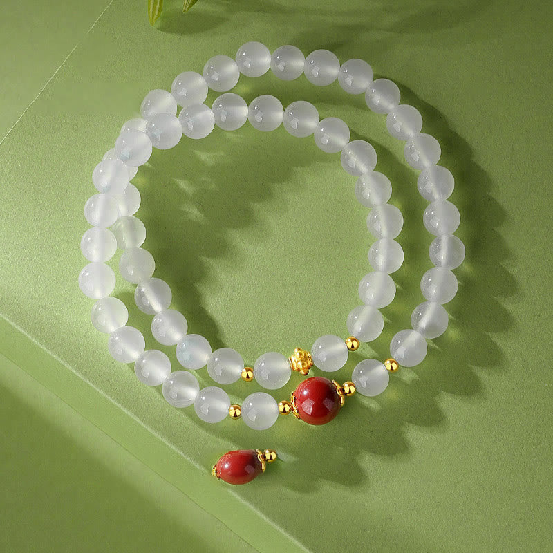Weißes Perlenarmband mit rotem Zinnober Anhänger Schutz Armband 925 Silber