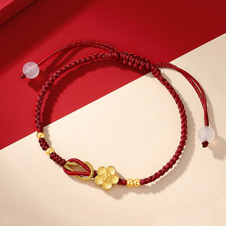 Rotes Armband mit Glücksblüte und rosafarbenem Stein elastisch