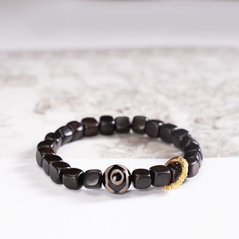 Armband Ebenholz schwarze Perlen Gold-Akzent Balance Ruhe elastisch