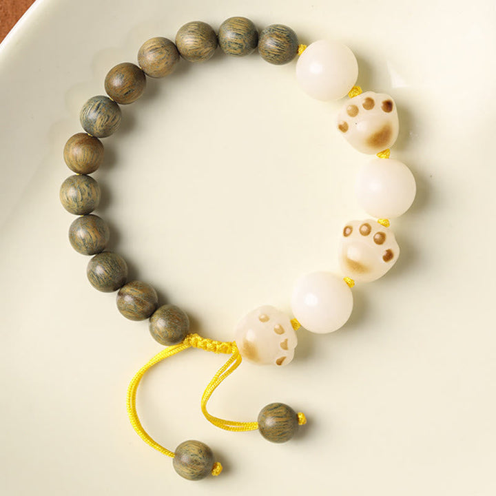 Armband Sandelholz Bodhi Katze mit weißen Perlen elastisch.