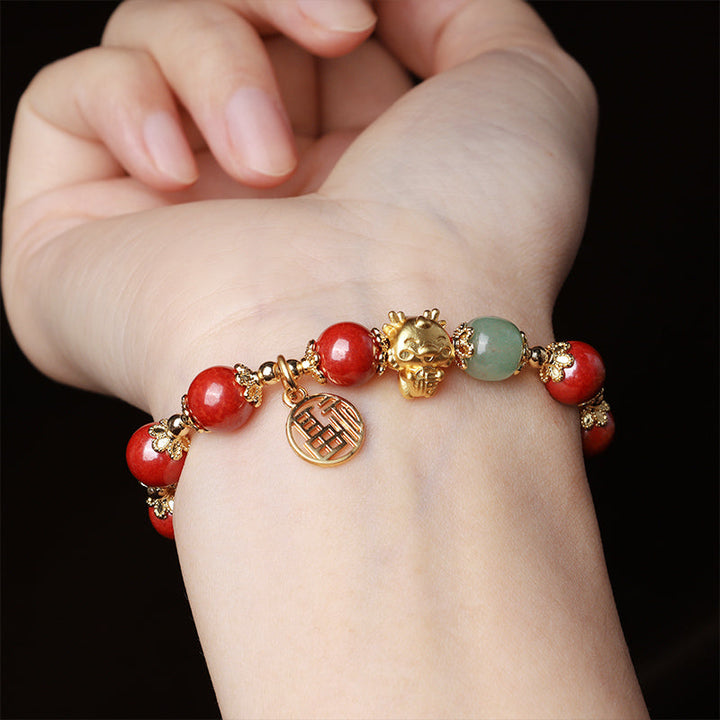 Armband Zinnober Fu-Zeichen rote Perlen Jade goldene Verzierungen Handgelenk