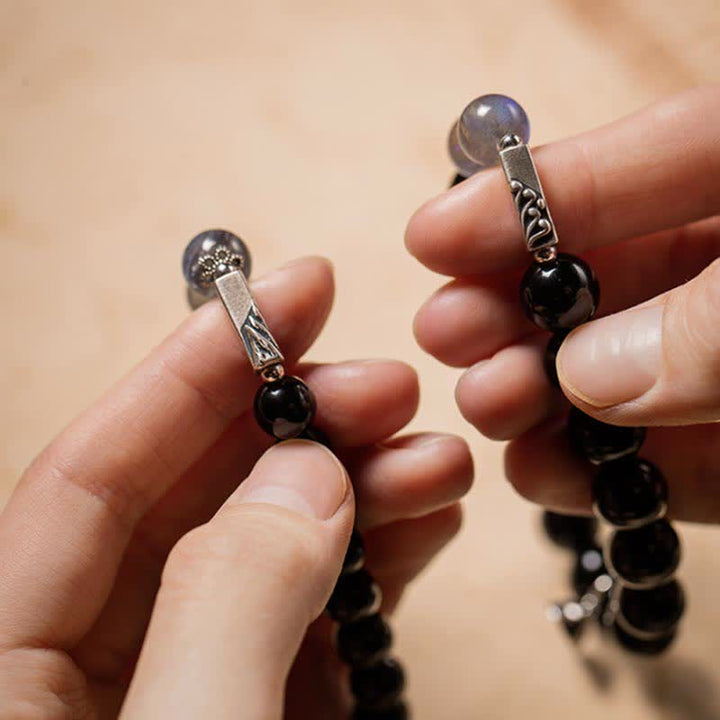 Mondstein Armband 925 Silber Paar Handgelenk schwarze Perlen getragen