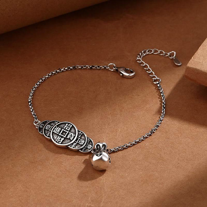 Silberarmband mit chinesischen Münzen und Glöckchen Anhänger elegant.