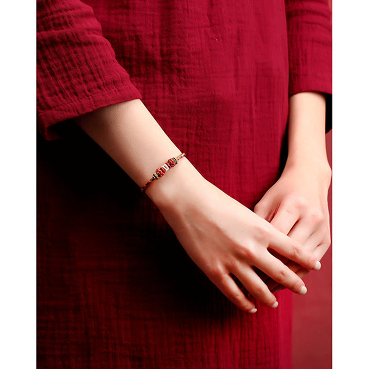Armband Geflochtenes Rotes Schnur Karma am Handgelenk getragen rotes Textil