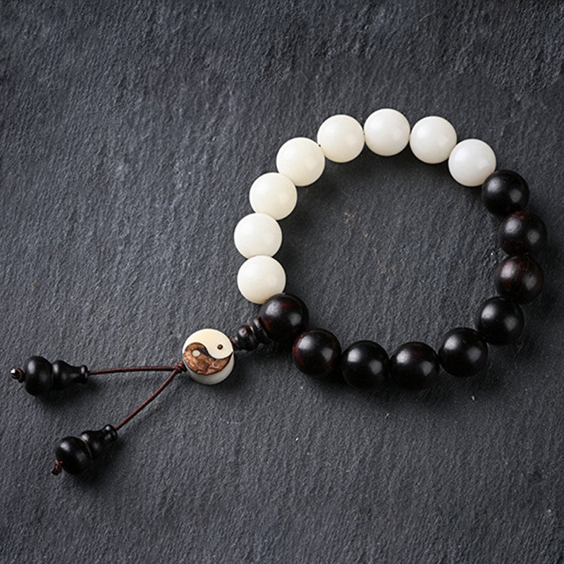 Armband Ebenholz – Schutz mit weißen und schwarzen Perlen elastisch.