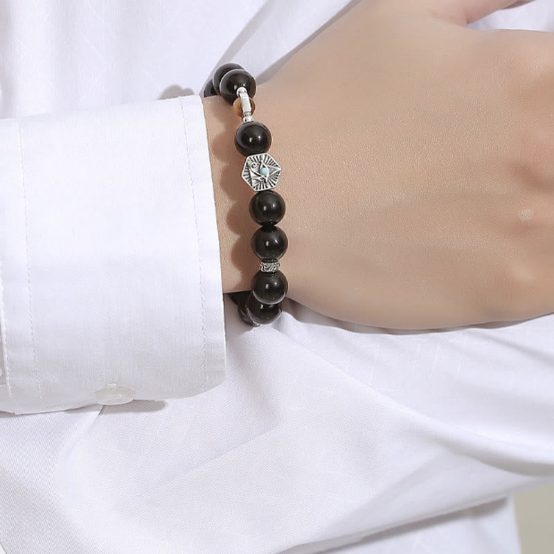 Schwarzes Obsidian Armband 925 Silber elegant am Handgelenk getragen