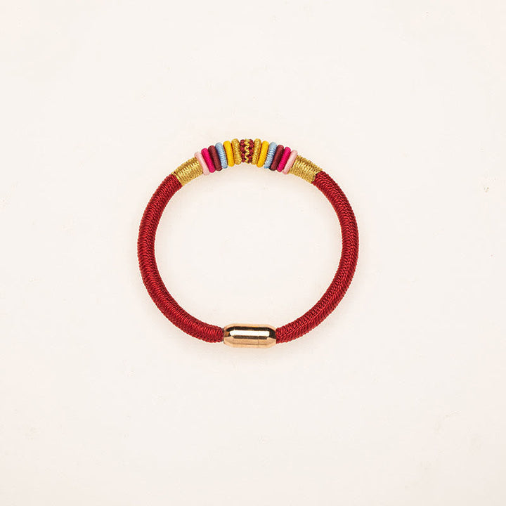 Rotes magnetisches Armband mit goldenen und bunten Perlen elastisch