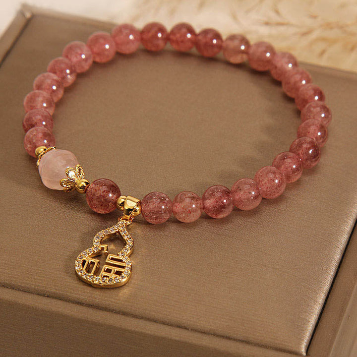 Armband Erdbeerquarz Fu-Zeichen rosé Perlen gold Anhänger elegant