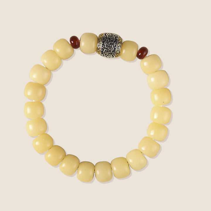 Bodhi-Samen Armband mit Granat und silbernem Zwischenteil elegant.