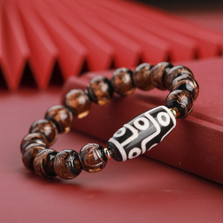 Armband – Wohlstand Balance braun Achat Perlen mit Tibetan-Motiv Bead