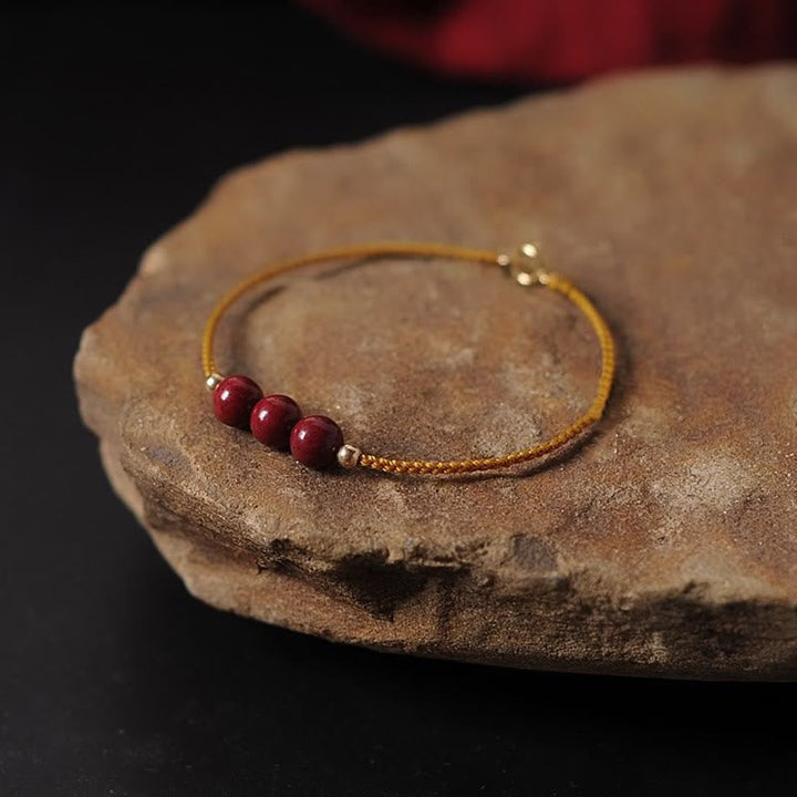 Armband Zinnober – Segen & Segen rote Perlen goldene Kette Stein