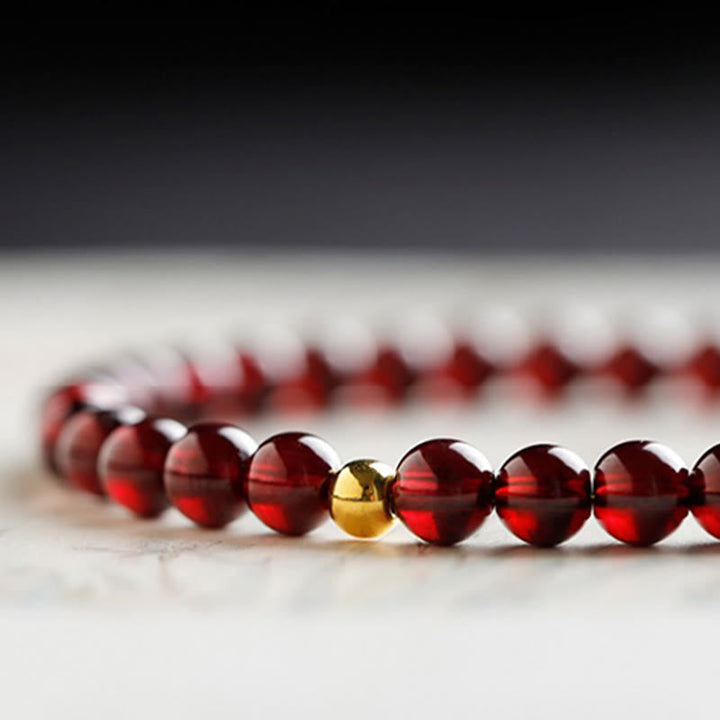 Armband Granat Koi Fisch Schutz rote Perlen goldene Perle Strang