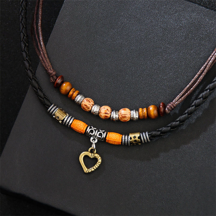 Armband – Heilung & Liebe & Energie mit Holzperlen und Herzanhänger.