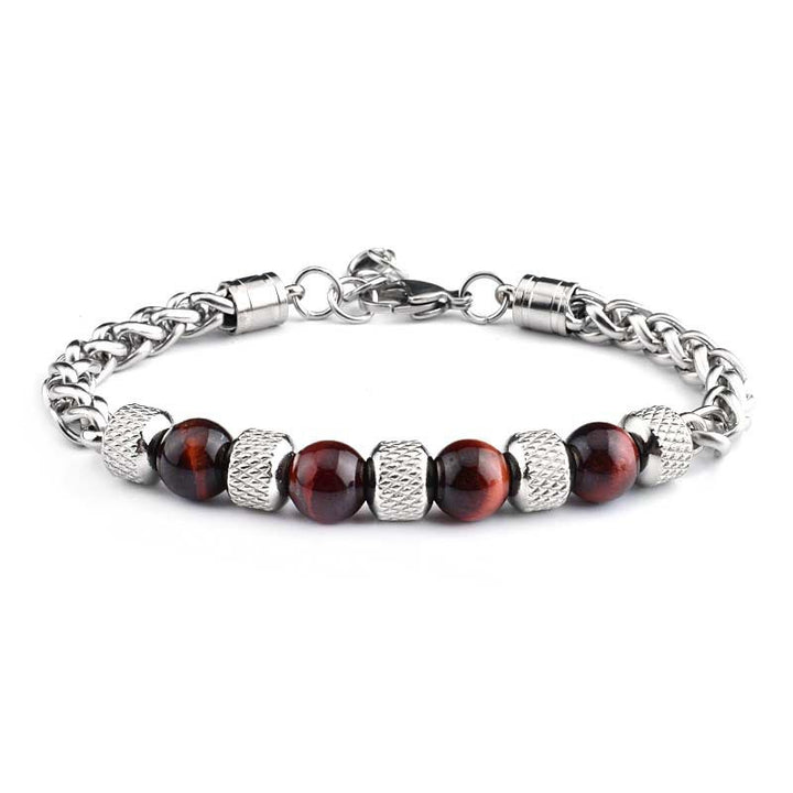 Silbernes Armband mit roten Granat-Kugeln und strukturierten Metallperlen Nahaufnahme