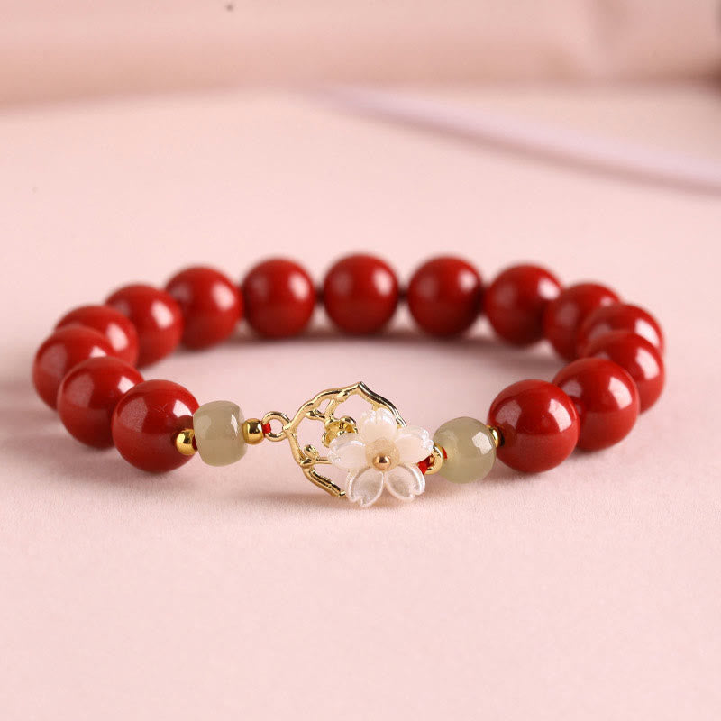 Armband Zinnober Jade – Segen rote Perlen Blütenanhänger elegant