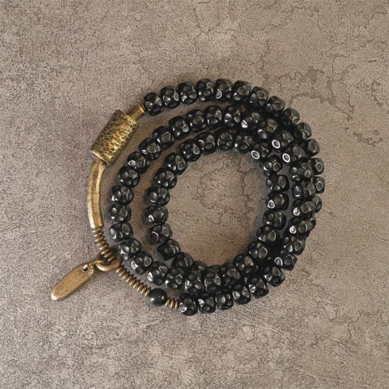 Armband Kupfer Retro Coconut schwarze Perlen Glück elastisch getragen