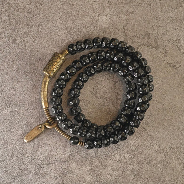 Armband Kupfer Retro Coconut schwarze Perlen Glück elastisch getragen