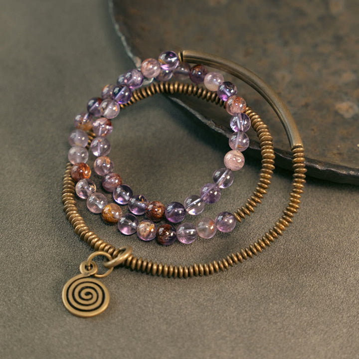 Armband Kupfer – Liebe mit Amethyst Perlen und Spiralanhänger bronze