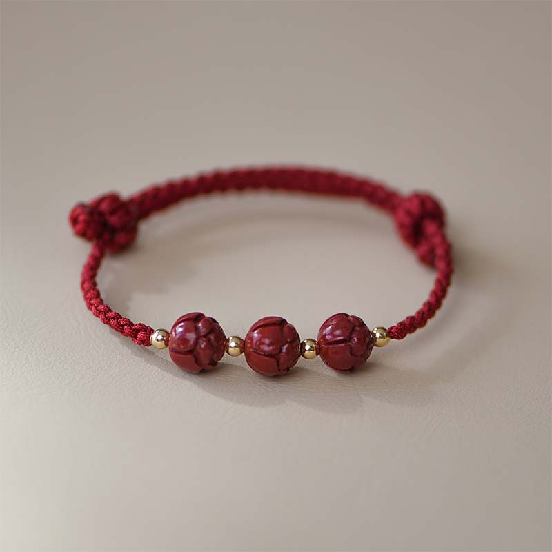 Rotes Armband mit Jade-Perlen und goldenem Zinnober Lotus Design elastisch