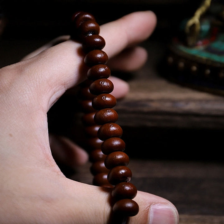 Mala Kupfer Bodhi Harmonie Armband braun Holzperlen Hand getragen
