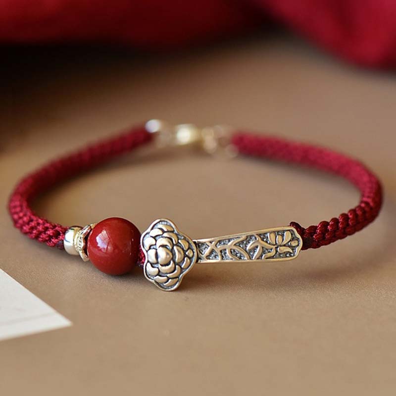 Rotes Armband 925 Silber Zinnober mit floraler Blüten-Charm elastisch.