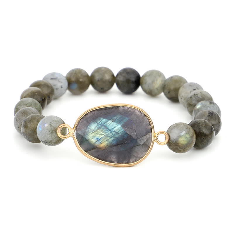 Armband Labradorit Mondstein mit goldenem Verschluss Nahaufnahme grauer Naturstein