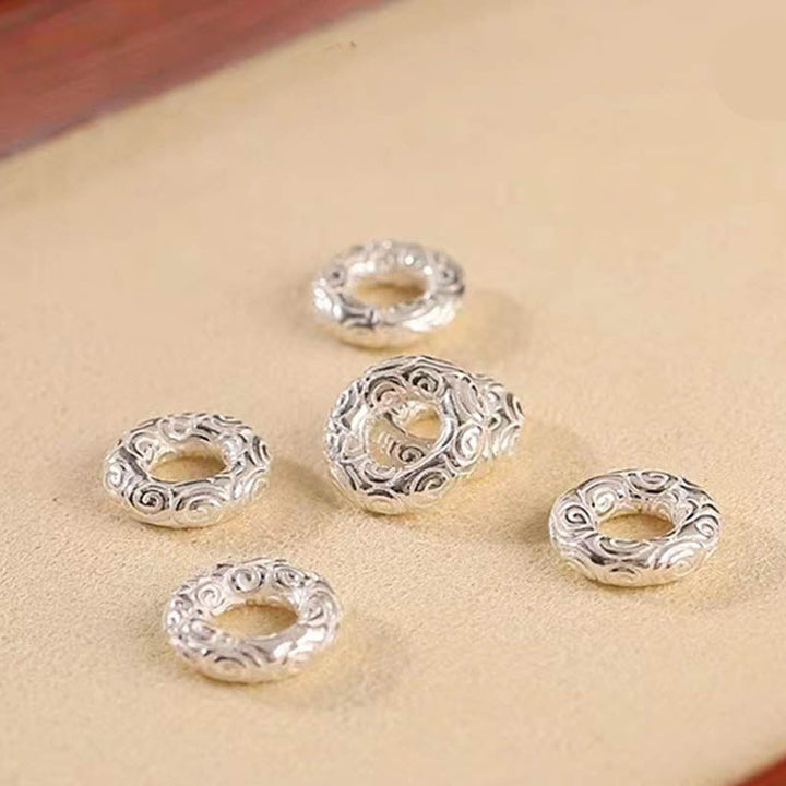 Silberne Perlen mit Ornamenten für Schmuckherstellung, 925er Silber.