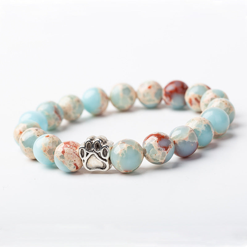 Armband Achat – Ruhe mit hellblauen Natursteinen und Pfötchen-Charm.
