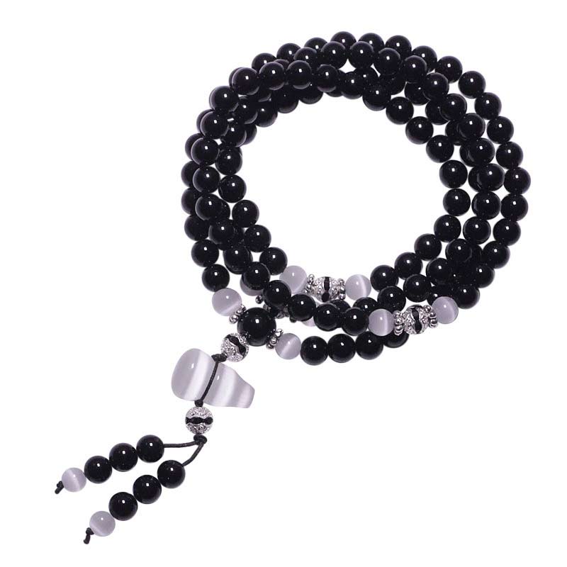 Armband Weißer Kristall Schwarzer Onyx Perlen elastisch Naturstein Schmuck.