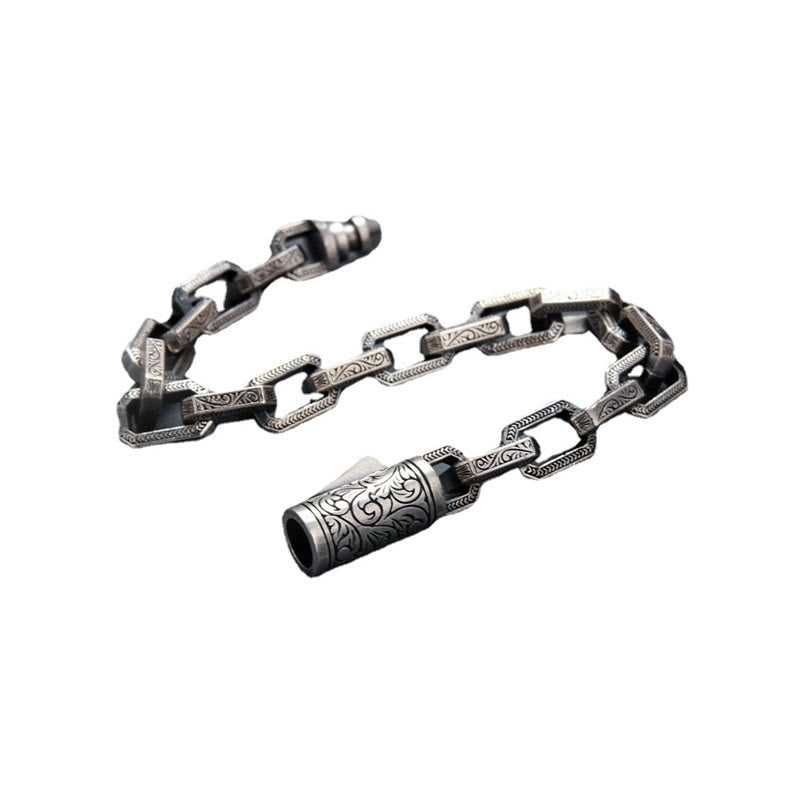 Silbernes Armband – Glück & Energie mit ornamentaler Kettengliederung und Zylinder.