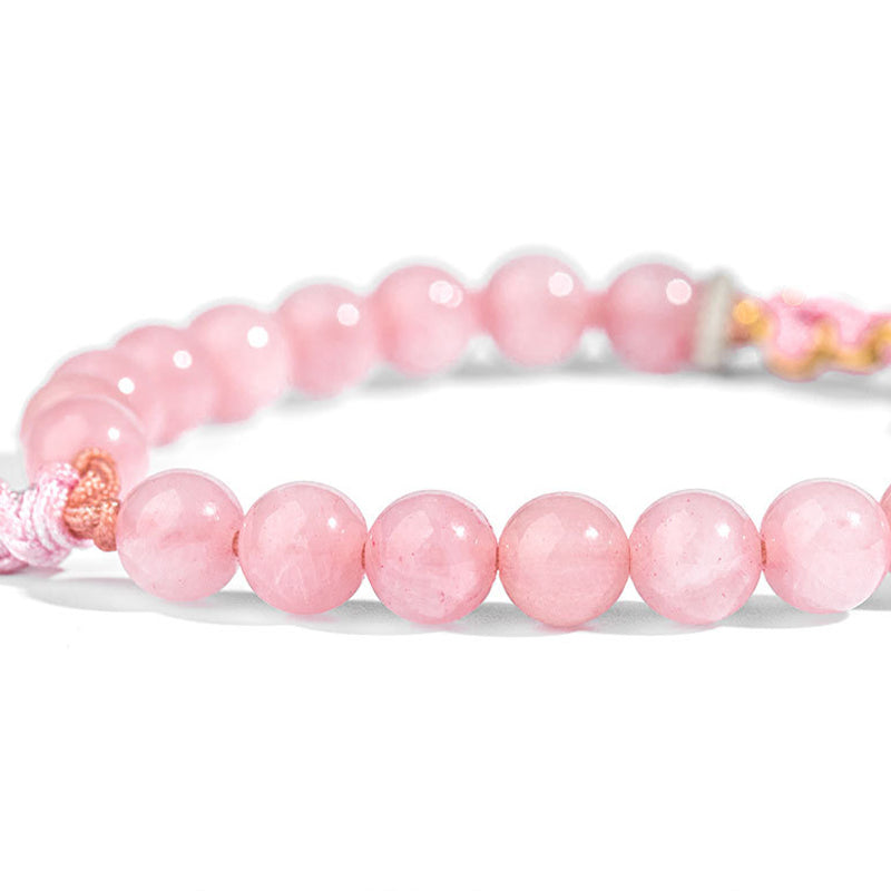 Rosaquarz Armband elastisch Naturstein Perlen rosa glänzend getragen
