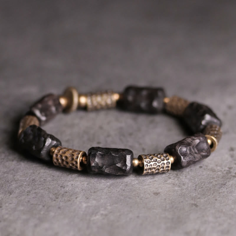 Armband Kupfer Ebenholz mit schwarzen Steinen und metallischen Perlen elegant.