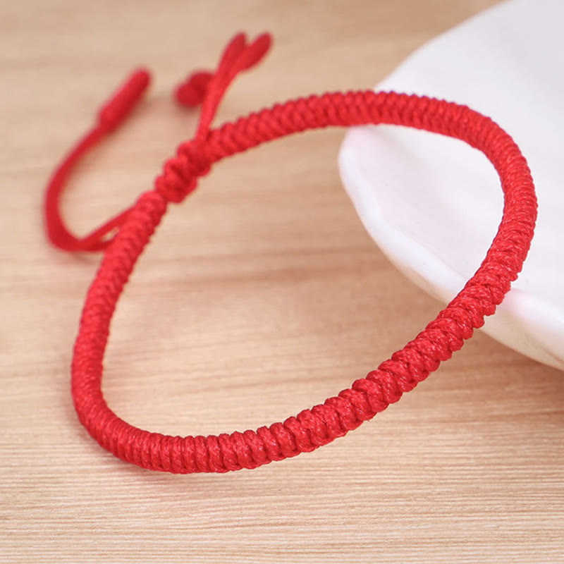 Rotes geflochtenes Armband Tibet Knoten Schutz elastisch tragbar.