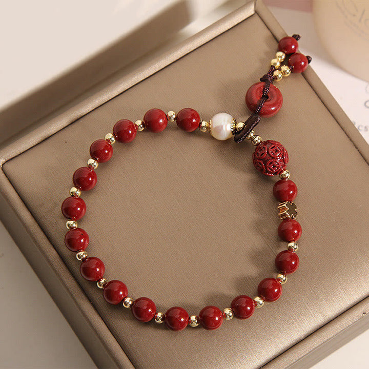 Armband Zinnober Kupfer mit roten Perlen goldenen Spacern elegant.
