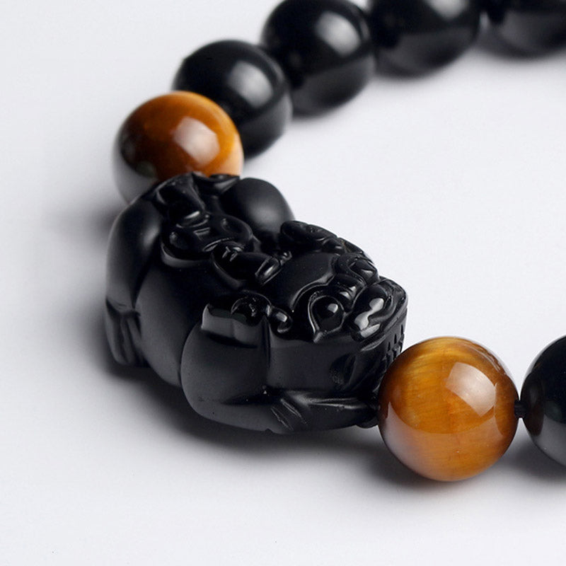 Armband Tigerauge Obsidian Pixiu Wohlstand Nahaufnahme schwarze Perlen braun