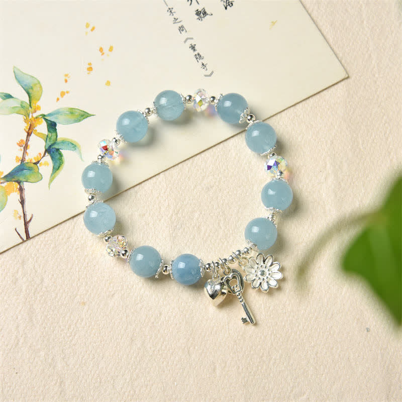 Aquamarin Armband 925 Silber mit Blütenanhängern elegant präsentiert.