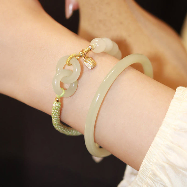 Jade Armband mit Fu-Zeichen, goldene Verschlüsse, elegante Armschmuck-Kombination