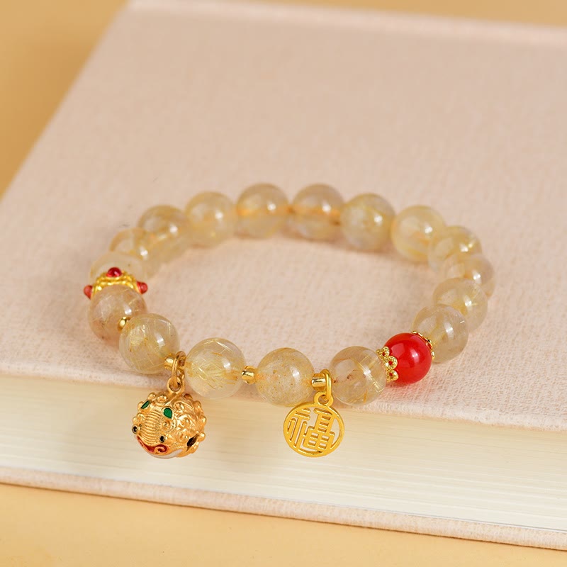 Armband Fu-Zeichen Wohlstand mit Citrin Perlen und roten Akzenten.