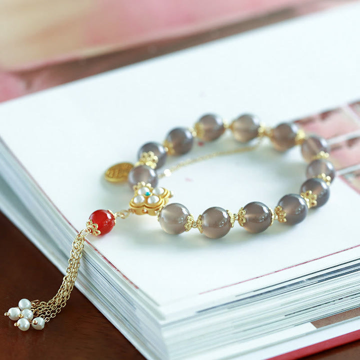 Armband Achat Perle Fu-Zeichen Balance elegantes Design Goldakzente