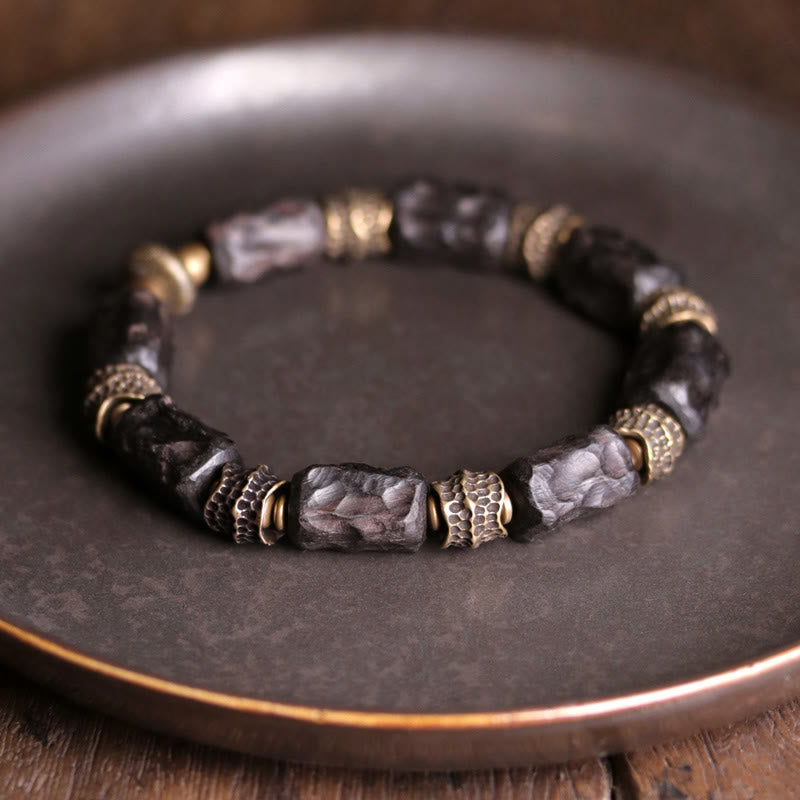 Armband Kupfer Ebenholz mit schwarzen Steinen und Metallperlen elastisch.