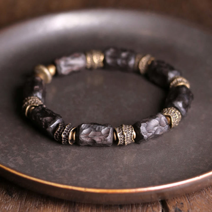 Armband Kupfer Ebenholz mit schwarzen Steinen und Metallperlen elastisch.