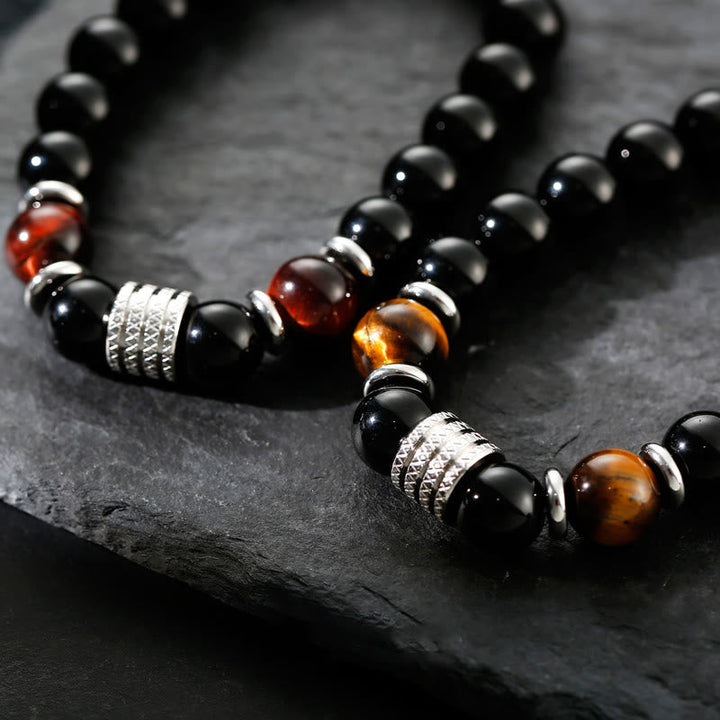 Armband Schwarzer Obsidian Tigerauge – Stärke mit silbernen Perlen elegant.