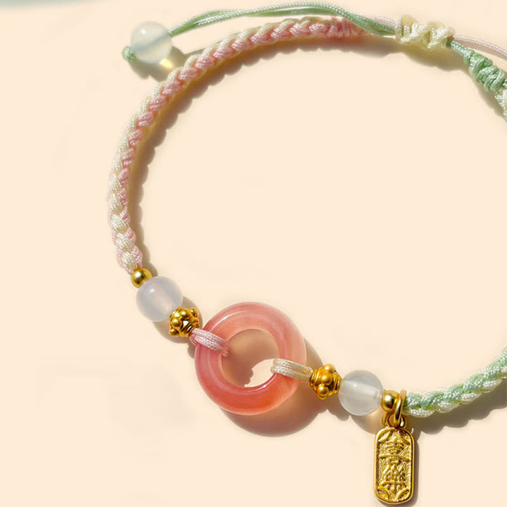 Armband Achat – Frieden Energie rosafarbener Stein goldene Perlen Schnur